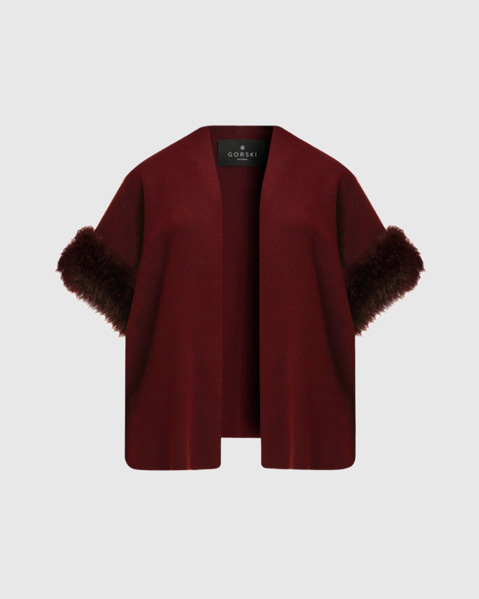Gilet en tricot avec garniture en peau d'agneau mongole sélectionnée (Tg)