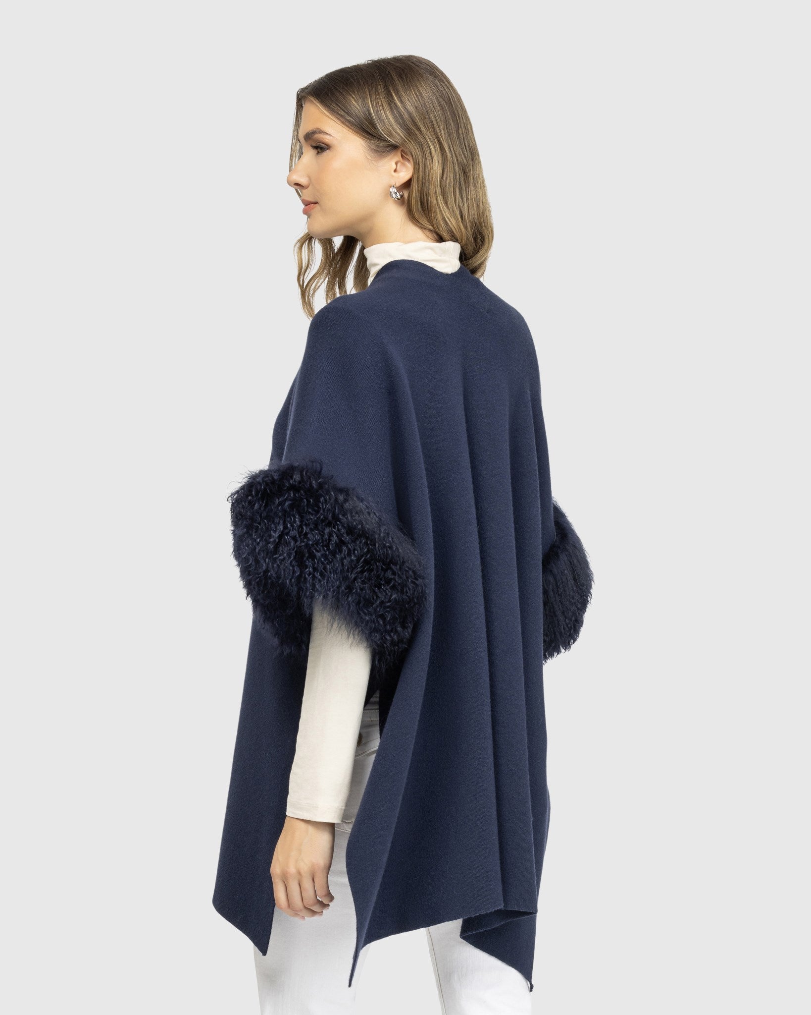 Gilet en tricot avec garniture en peau d'agneau mongole sélectionnée (Tg)
